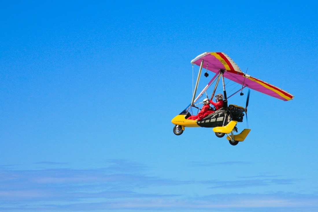 The trike crossing a wide, clear sky